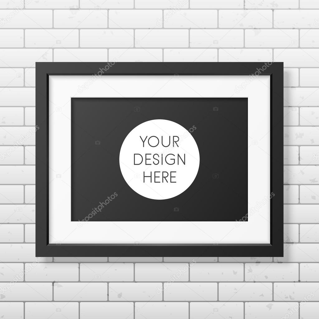 Realistic black frame A4 on the brick wall background