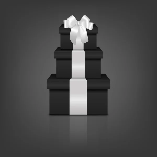 Stack of three realistic black gift boxes with white ribbon and bow — Stockvector