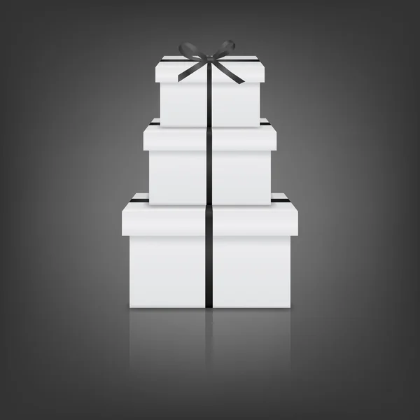 Stapel von drei realistischen weißen Geschenkboxen mit schwarzem Band und Schleife — Stockvektor