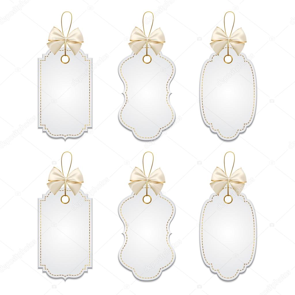 Set of elegant tags with silver and golden bows