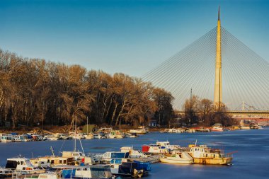 Belgrade / Serbia - January 15, 2017: The Ada Bridge, a cable-stayed bridge over the frozen Sava river in winter in Belgrade, Serbia