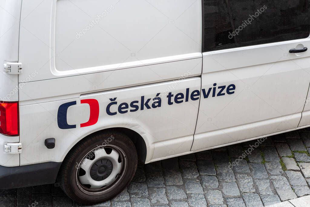 A white van with the logo of Czech National Television, parked on cobblestone street in Prague, Czech Republic on 8 July 2024
