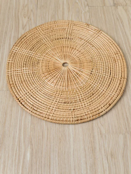 weave tray on warm wood background