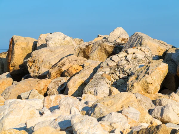 stock image Large stones on the stone beach in the background