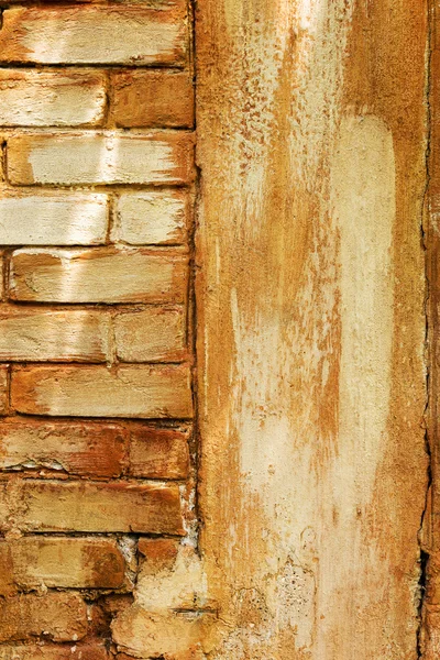 Brick wall, weathered, worn wall damaged paint. Grunge Concrete Stock Photo