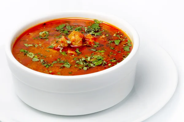 Borsch soup with meat, tomatoes and herbs in a white cup — Stock Photo, Image