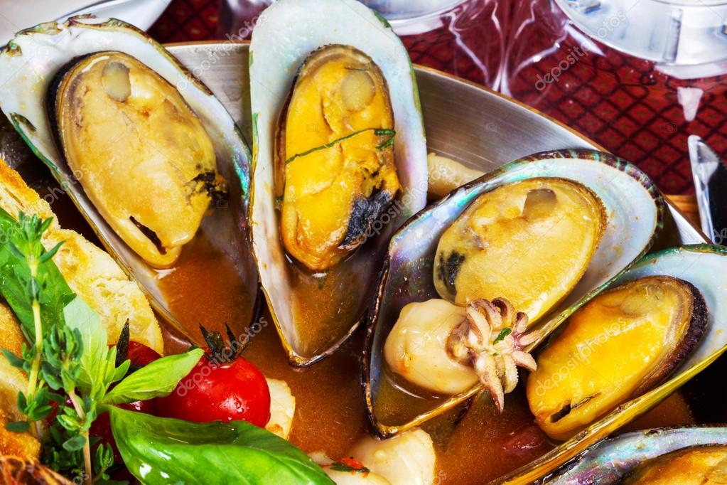 Cooked mussels and seafood sauce, selective focus Stock Photo by ©elena