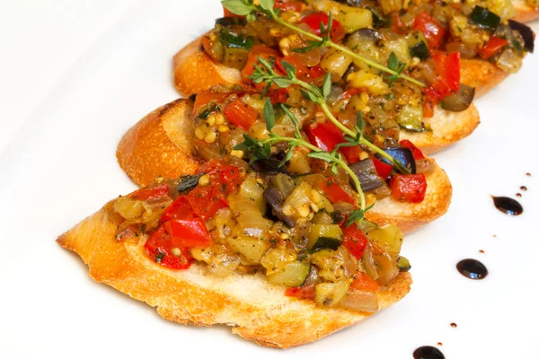 Bruschetta (Italian Toasted Garlic Bread) with stewed vegetables