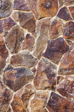 Doğal taştan örülmüş duvar. arka plan olarak kullanılabilir 