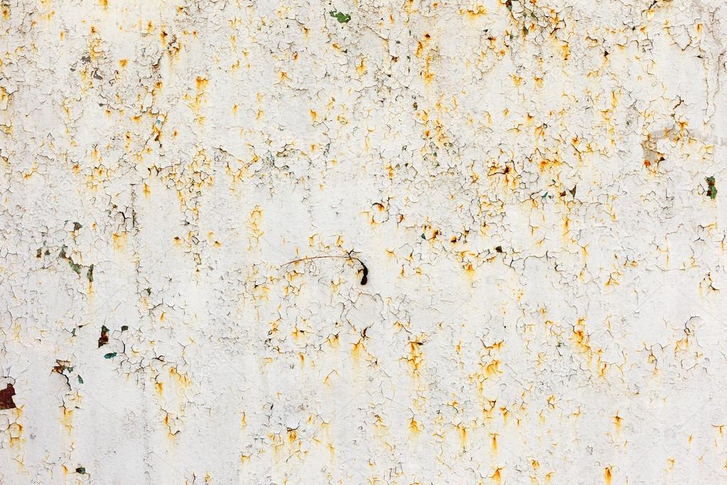 Abstract rusty metal surface with cracked white paint. Textured Stock
