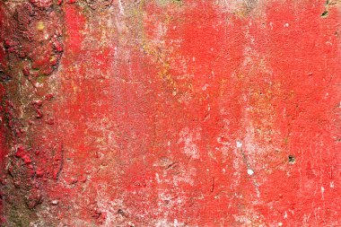Abstract background concrete painted with red paint, weathered w