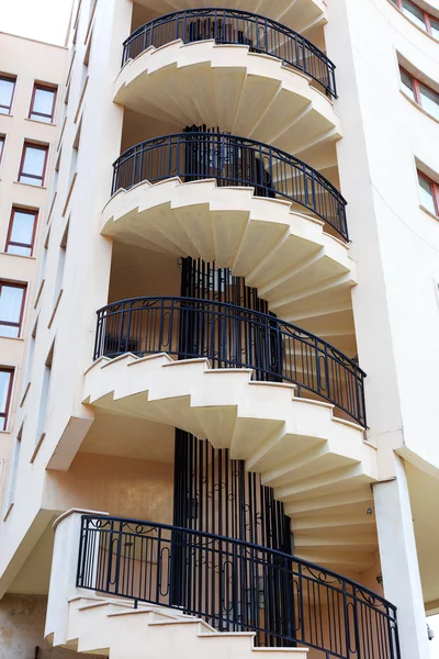 Spiral staircase on the outside facade of the house — Stock Photo, Image