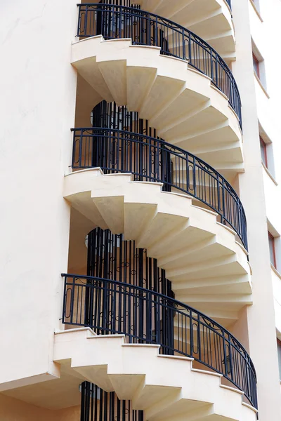 Spiral staircase on the outside facade of the house — Stock Photo, Image