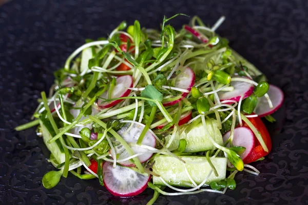 Authentic Fresh Vegetable Salad Sprouts Peas Black Pepper Black Plate — Stock Photo, Image