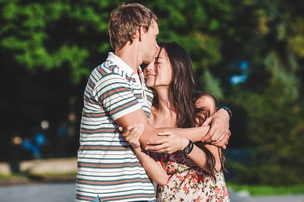 Beautiful couple in love walks down the street — Stock Photo, Image