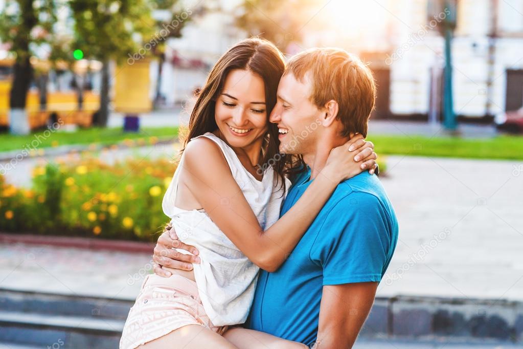 beautiful girl hugging a loved one guy