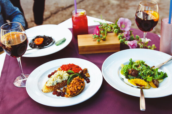 A beautiful decorated table in the restaurant with delicious dishes. The concept of a romantic dinner for lovers