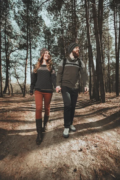 Couple of hikers walking in the wood — Stock Photo, Image