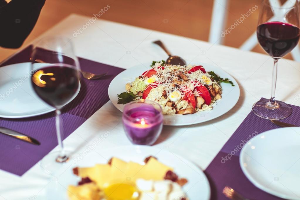 glasses with red wine on the table in the restaurant