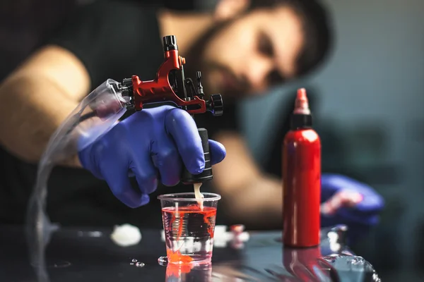 Tattooist makes a tattoo