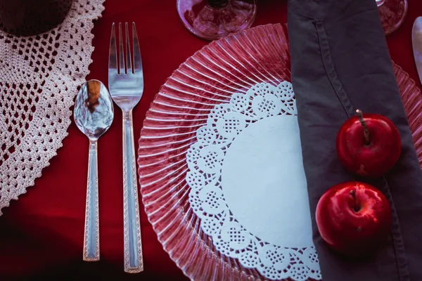 Beautifully decorated table with spoons on lace napkins and apples — Stock Photo, Image