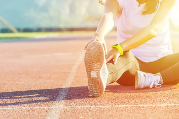 Female sport fitness runner getting ready for jogging outdoors