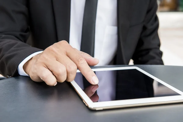 Business man using a variety of mobile devices, mobile phones, smart watches, tablet, computer