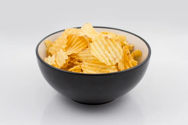 Ribbed potato chips in a bowl — Stock Photo, Image