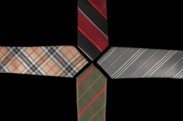 Quatre cravates avec leurs extrémités face à face — Photo