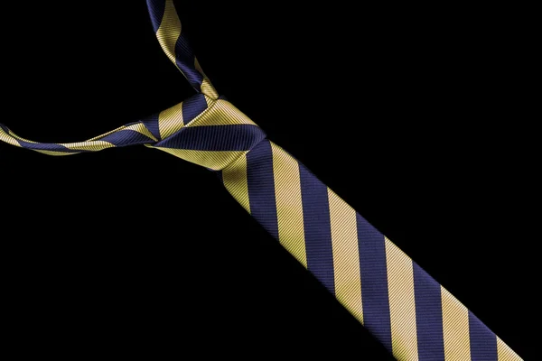 Necktie in silk with gold and blue stripes — Stock Photo, Image