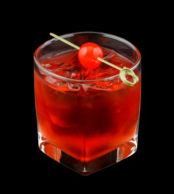 Red drink with a maraschino cherry isolated on black