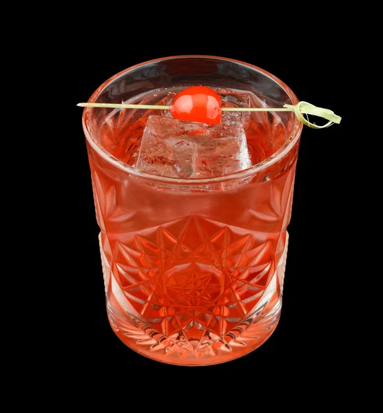 Red drink with a maraschino cherry isolated on black — Φωτογραφία Αρχείου