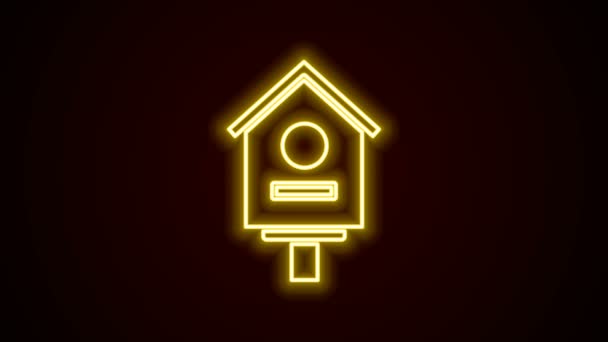 Glowing neon line Bird house icon isolated on black background. Nesting box birdhouse, homemade building for birds. 4K Video motion graphic animation — Stock Video