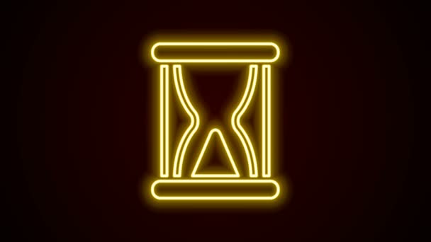 Glowing neon line Old hourglass with flowing sand icon isolated on black background. Sand clock sign. Business and time management concept. 4K Video motion graphic animation — Stock Video