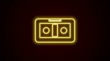 Parlayan neon hattı VHS video kaset ikonu siyah arkaplanda izole edildi. 4K Video hareketli grafik canlandırması