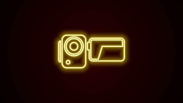 Glowing neon line Cinema camera icon isolated on black background. Video camera. Movie sign. Film projector. 4K Video motion graphic animation — Stock Video