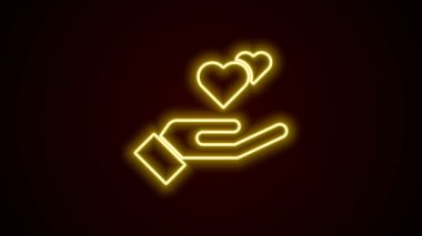 Parlayan neon çizgisi. El simgesindeki kalp, siyah arkaplanda izole edilmiş. El çabukluğu aşk sembolü. Sevgililer Günü sembolü. 4K Video hareketli grafik canlandırması