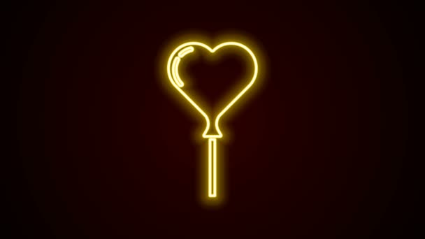 Glödande neon line ballonger i form av hjärta med band ikon isolerad på svart bakgrund. 4K Video motion grafisk animation — Stockvideo