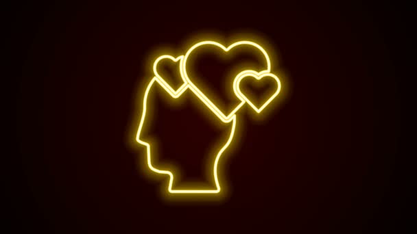 Świecąca neonowa linia Ludzka głowa z ikoną serca odizolowana na czarnym tle. Koncepcja miłości z ludzką głową. 4K Animacja graficzna ruchu wideo — Wideo stockowe