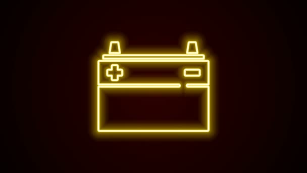 ネオンラインの輝き黒の背景に隔離された車のバッテリーアイコン。蓄電池のエネルギー電力と電気蓄電池。4Kビデオモーショングラフィックアニメーション — ストック動画