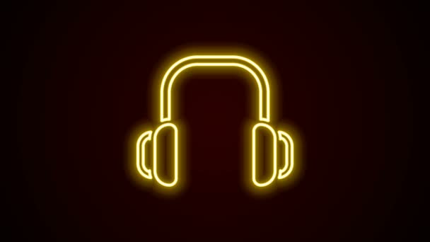 Ragyogó neon vonal Téli fejhallgató ikon elszigetelt fekete háttérrel. Füldugó jel. 4K Videó mozgás grafikus animáció — Stock videók