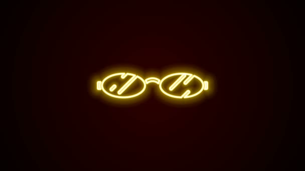Parlayan neon çizgisi Gözlük simgesi siyah arkaplanda izole edildi. 4K Video hareketli grafik canlandırması — Stok video
