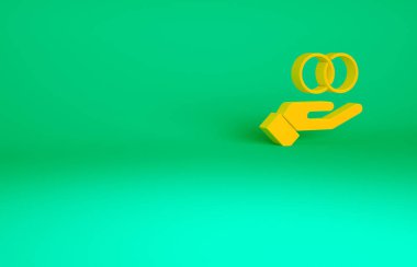 Turuncu alyans ikonu yeşil arka planda izole edilmiş. Gelin ve damat mücevher tabelası. Evlilik sembolü. Elmas yüzük. Minimalizm kavramı. 3d illüstrasyon 3B canlandırma.