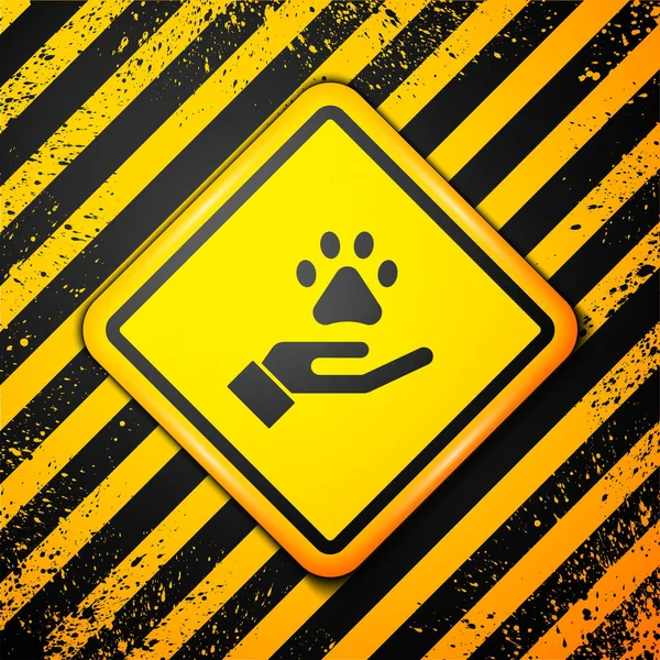 Schwarze Hände Mit Einem Fußabdrucksymbol Für Tiere Auf Gelbem Hintergrund — Stockvektor