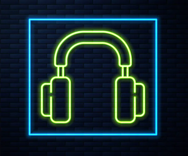 Glowing Neon Line Headphones Icon Isolated Brick Wall Background Earphones — Stock Vector