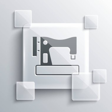 Gri arkaplanda gri dikiş makinesi simgesi var. Kare cam paneller. Vektör.