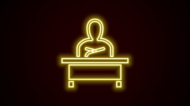 Glowing neon line Schoolboy sitting at desk icon isolated on black background. 4K Video motion graphic animation — Stock Video