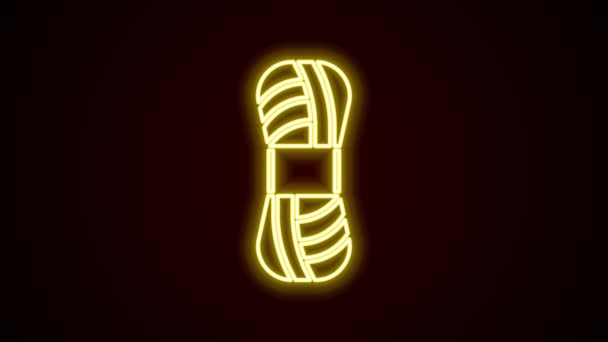 Glowing neon line Yarn icon isolated on black background. Label for hand made, knitting or tailor shop. 4K Video motion graphic animation — Stock Video