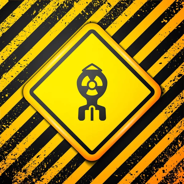 Icono de bomba nuclear negra aislado sobre fondo amarillo. Bomba cohete vuela hacia abajo. Señal de advertencia. Vector — Vector de stock