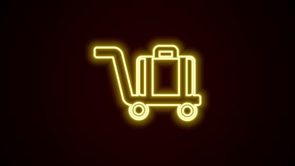 Gloeiende neon lijn Trolley koffer pictogram geïsoleerd op zwarte achtergrond. Reisbagagebord. Reisbagage icoon. 4K Video motion grafische animatie — Stockvideo